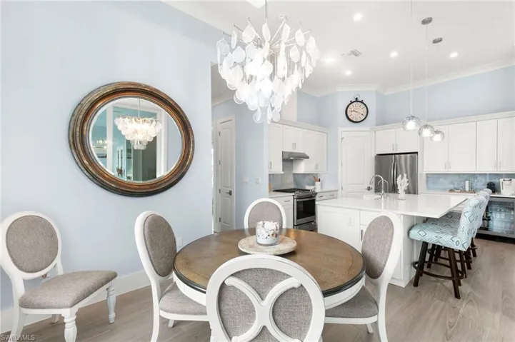Dining area with kitchen in the background