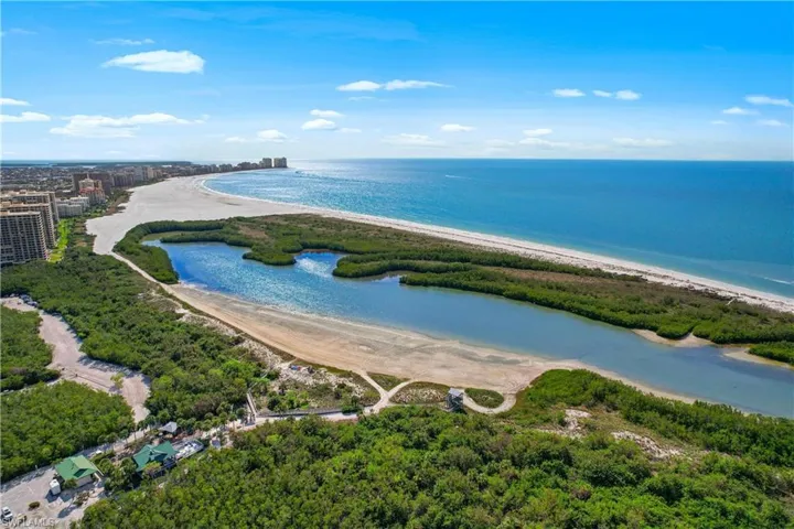 Aerial view featuring a view of the beach and a water view