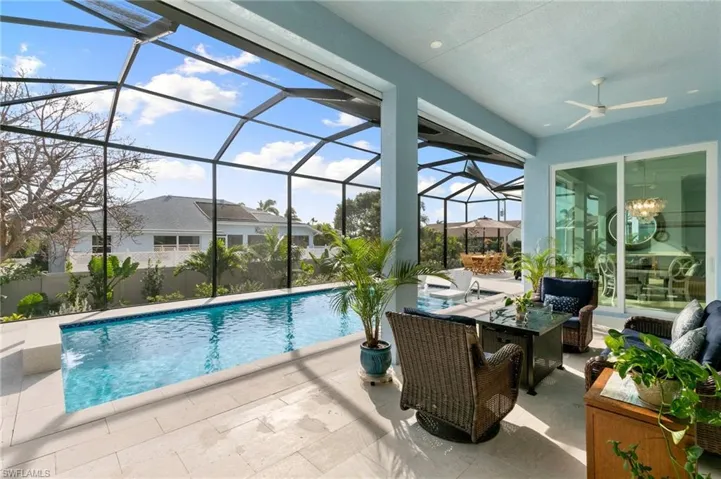 Pool and covered seating area on lanai