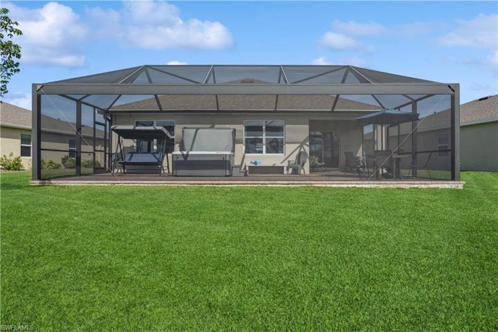 Back view with lush landscaping
