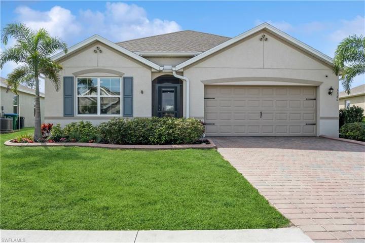 Front of property with paver driveway