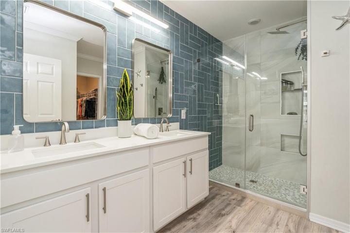 Owners' double vanities and shower with new glass door