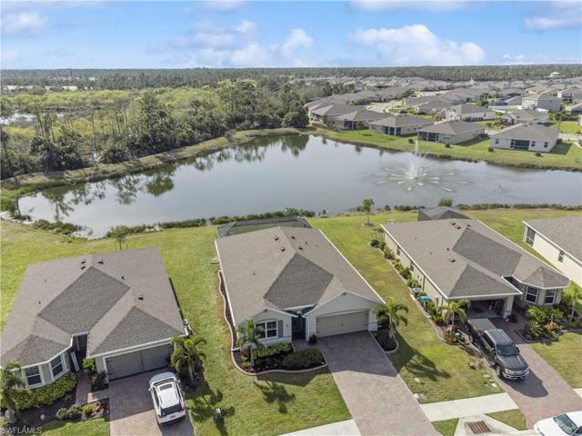 Property is on the lake with aerial view