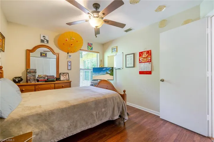 Bedroom with wood finished floors and ceiling fan