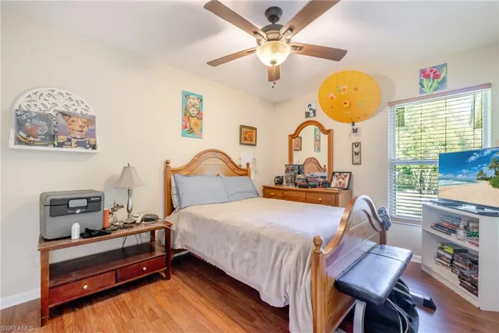 Bedroom featuring wood finished floors and ceiling fan