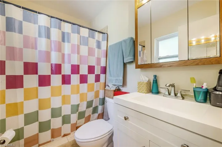 Bathroom featuring vanity and a shower with shower curtain