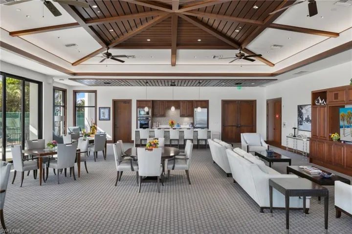 Building lobby featuring a high ceiling and recessed lighting