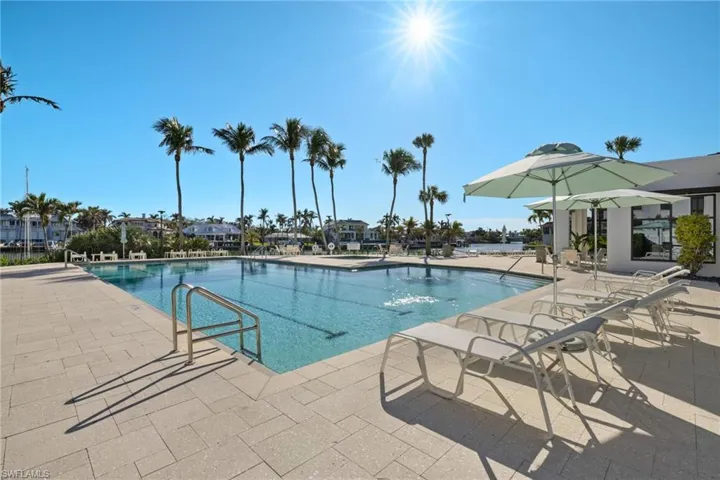 Community pool featuring a patio
