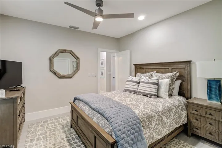 Bedroom featuring baseboards and ceiling fan