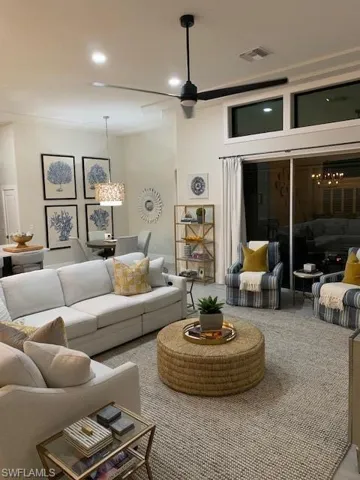 Living room featuring a chandelier and recessed lighting