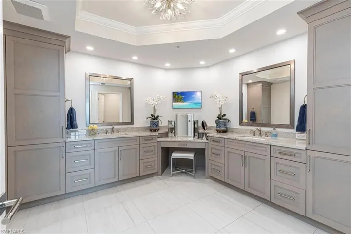 Master Bathroom with dual vanities, built in TV & Makeup nook