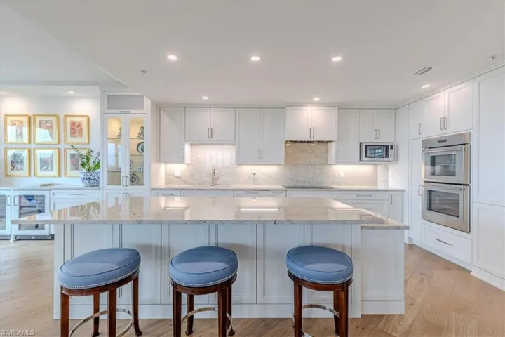 Kitchen with Granite counters & backsplash