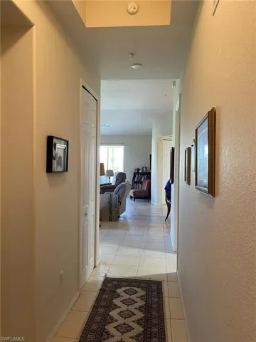 Entrance corridor with light tile floors