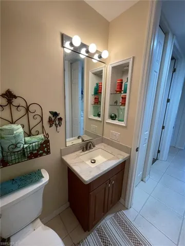 Bathroom with tile floors, toilet, and vanity