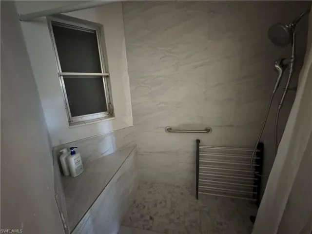Bathroom with tiled shower