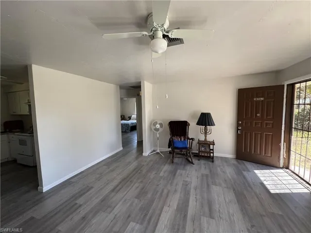 Living area featuring ceiling fan and hardwood / wood-style floors