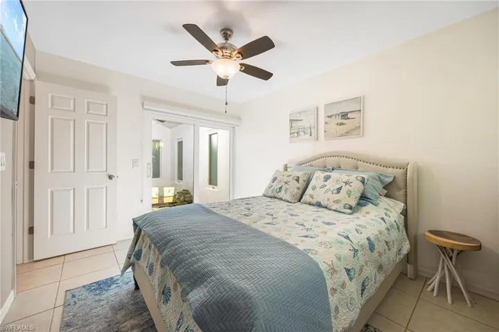 Bedroom featuring ceiling fan and light tile patterned flooring