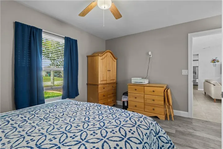 Bedroom featuring ceiling fan and light hardwood / wood-style floors