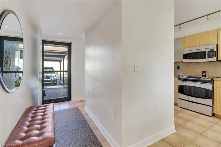 Tiled foyer with track lighting