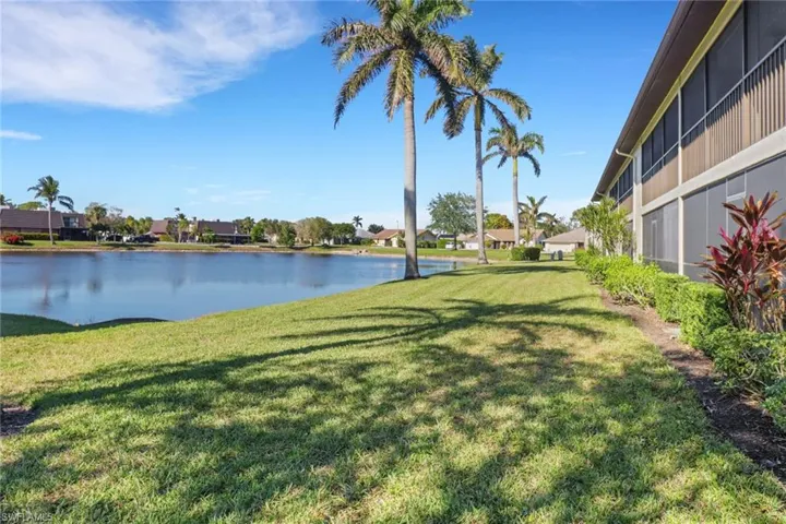 View of yard with a water view