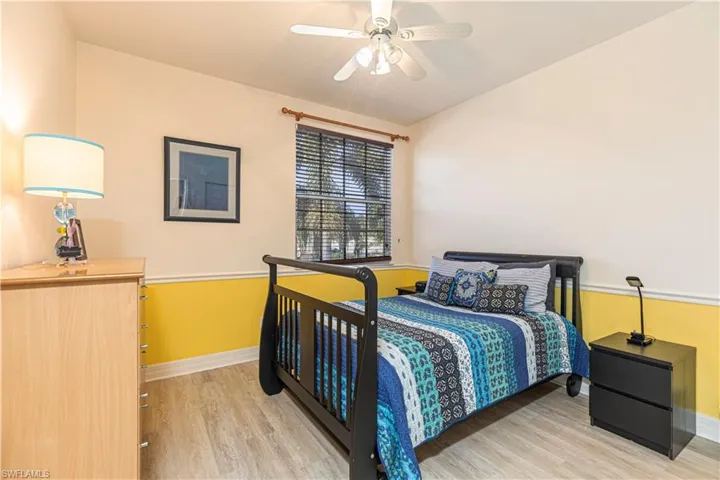 Bedroom with light wood-type flooring and ceiling fan