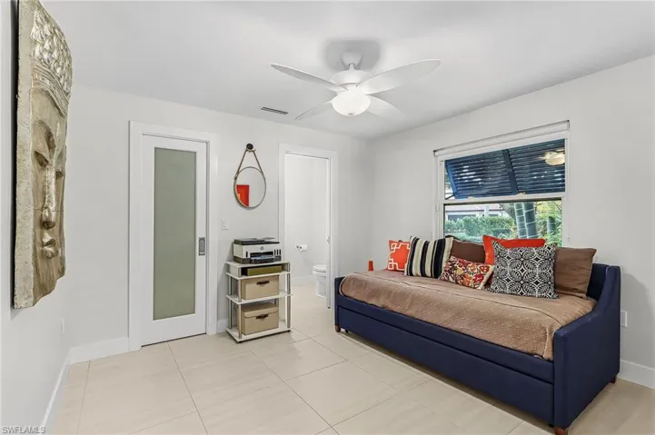 Bedroom featuring ceiling fan and light tile patterned floors