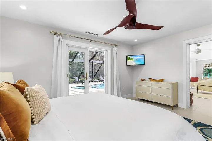 Bedroom featuring access to exterior, ceiling fan, and recessed lighting