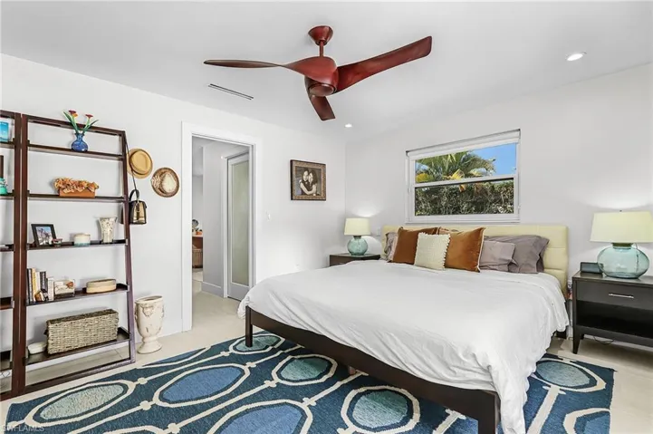 Bedroom with a ceiling fan and recessed lighting