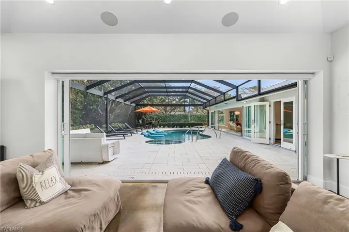 Outdoor pool with a sunroom