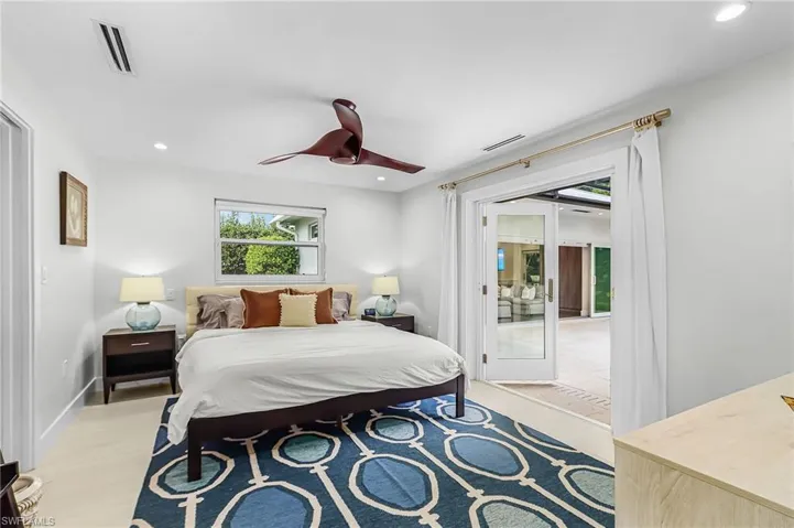 Bedroom featuring recessed lighting, a ceiling fan, access to outside, and light wood-style flooring