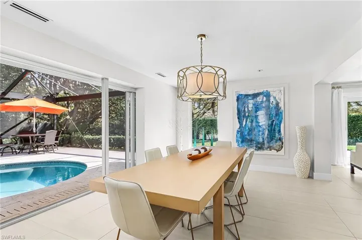Dining area featuring baseboards and light tile patterned floors