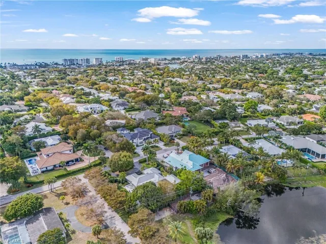 Aerial view of residential area with a large body of water