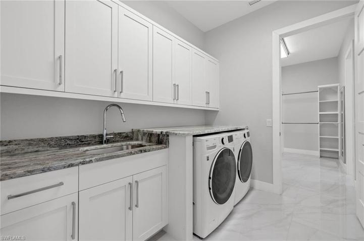 Laundry Room with double entry to owner's closet.