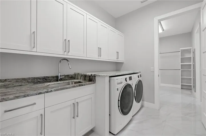 Laundry Room with double entry to owner's closet.