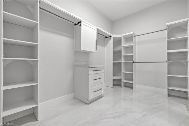 Owner's Closet with entry to laundry room.