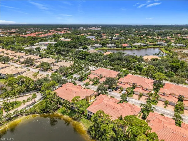 View of property location featuring a large body of water and nearby suburban area