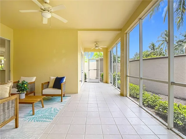 Sunroom / solarium featuring a ceiling fan, healthy amount of natural light, and tile patterned flooring