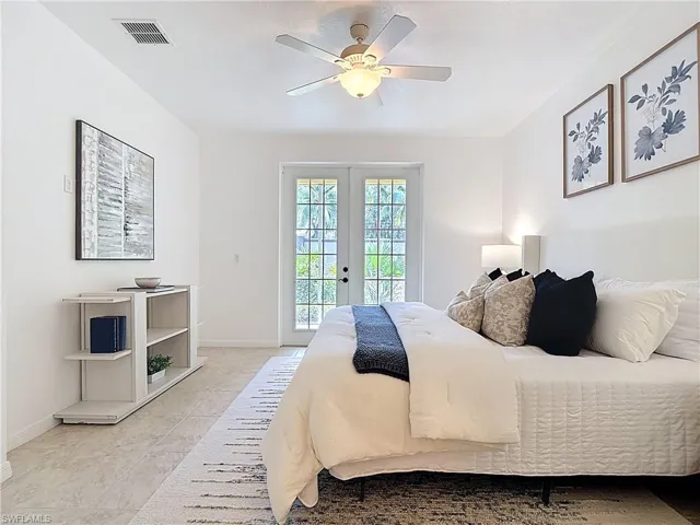 Bedroom with access to outside, french doors, and ceiling fan