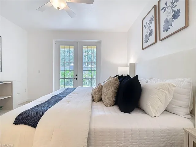 Bedroom featuring french doors, access to outside, and a ceiling fan