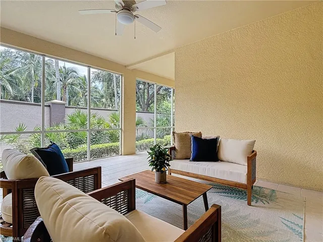 Sunroom featuring a textured wall