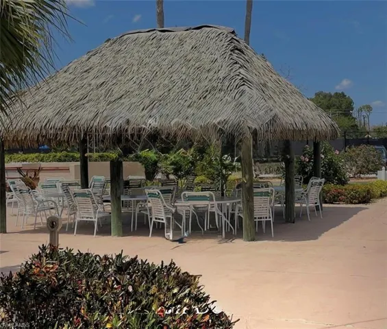 View of home's community featuring outdoor dining space and a patio area