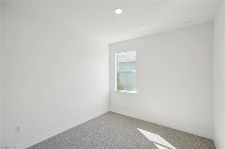 Unfurnished room with carpet flooring