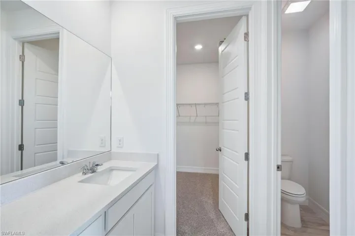 Bathroom with vanity and toilet