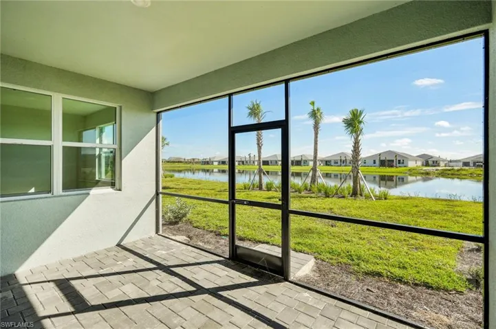 Sunroom / solarium with a water view