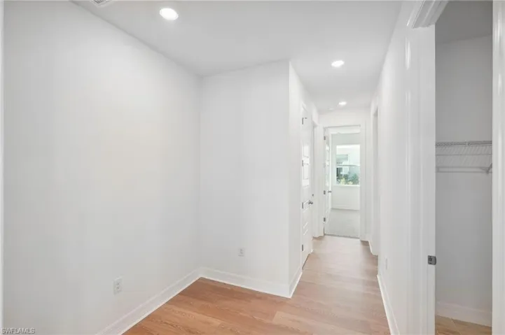 Corridor featuring light hardwood / wood-style flooring