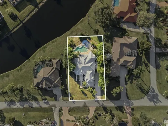 Aerial view of residential area with property parcel outlined