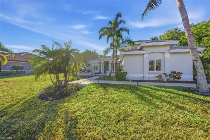 Mediterranean / spanish-style home featuring a front yard and stucco siding