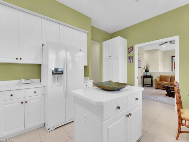 Kitchen is light and bright plenty of storage