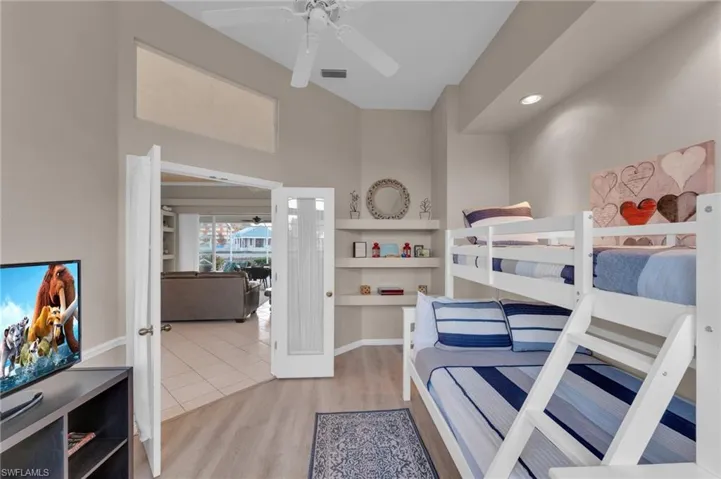Bedroom featuring ceiling fan and hardwood / wood-style floors