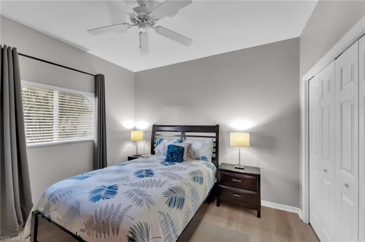 Bedroom featuring ceiling fan, a closet, and light hardwood / wood-style floors